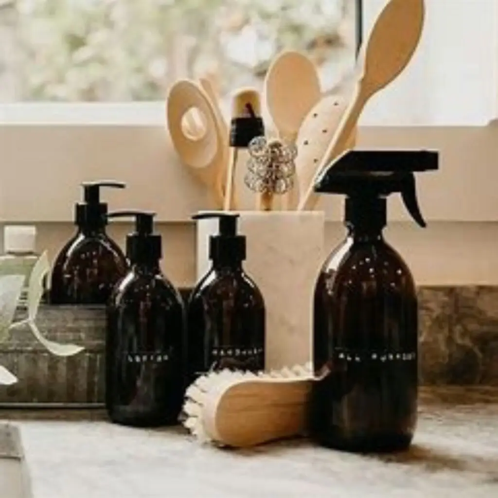 A DIY cleaning kit with reusable glass bottles and natural ingredients