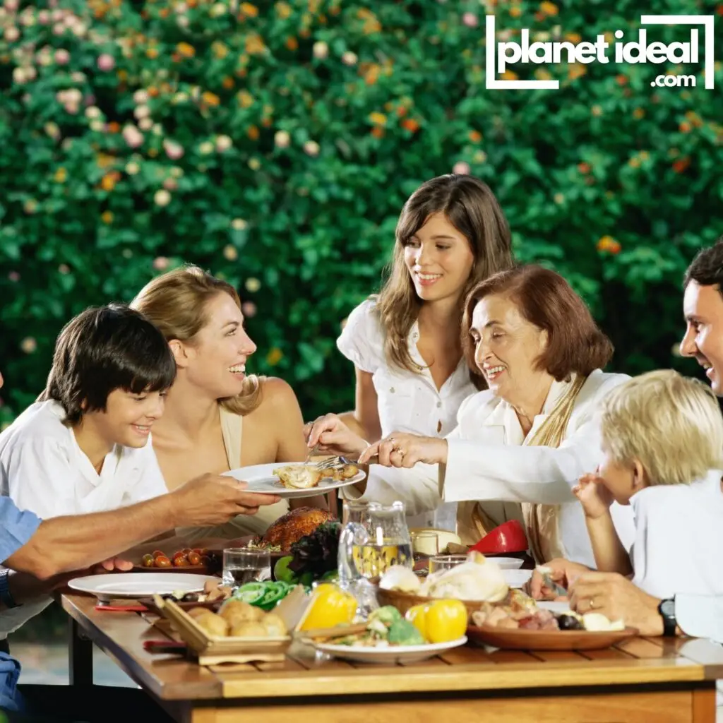 A family sharing a meal outdoors, laughing and connecting, symbolizing the importance of quality time.