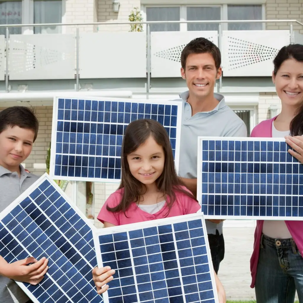 A happy family standing next to their solar-equipped home, symbolizing successful adoption despite challenges