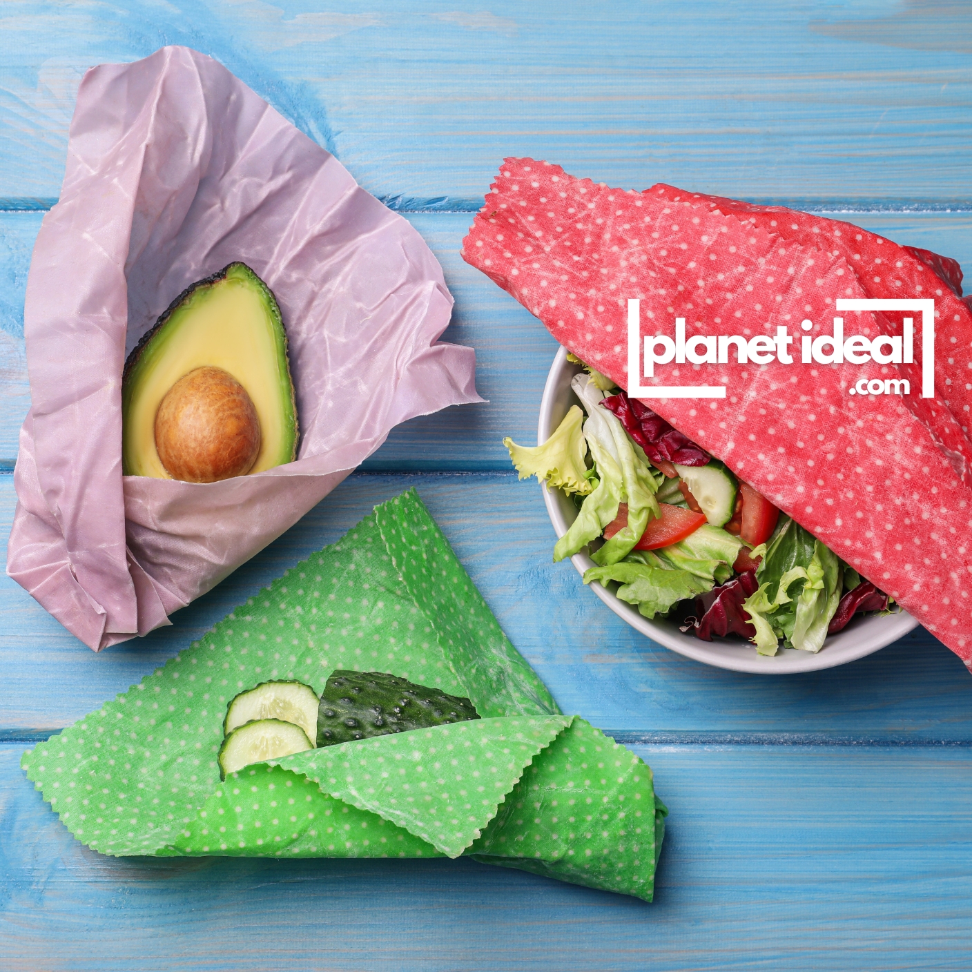 A kitchen counter with colorful beeswax wraps covering bowls and wrapping fresh vegetables.