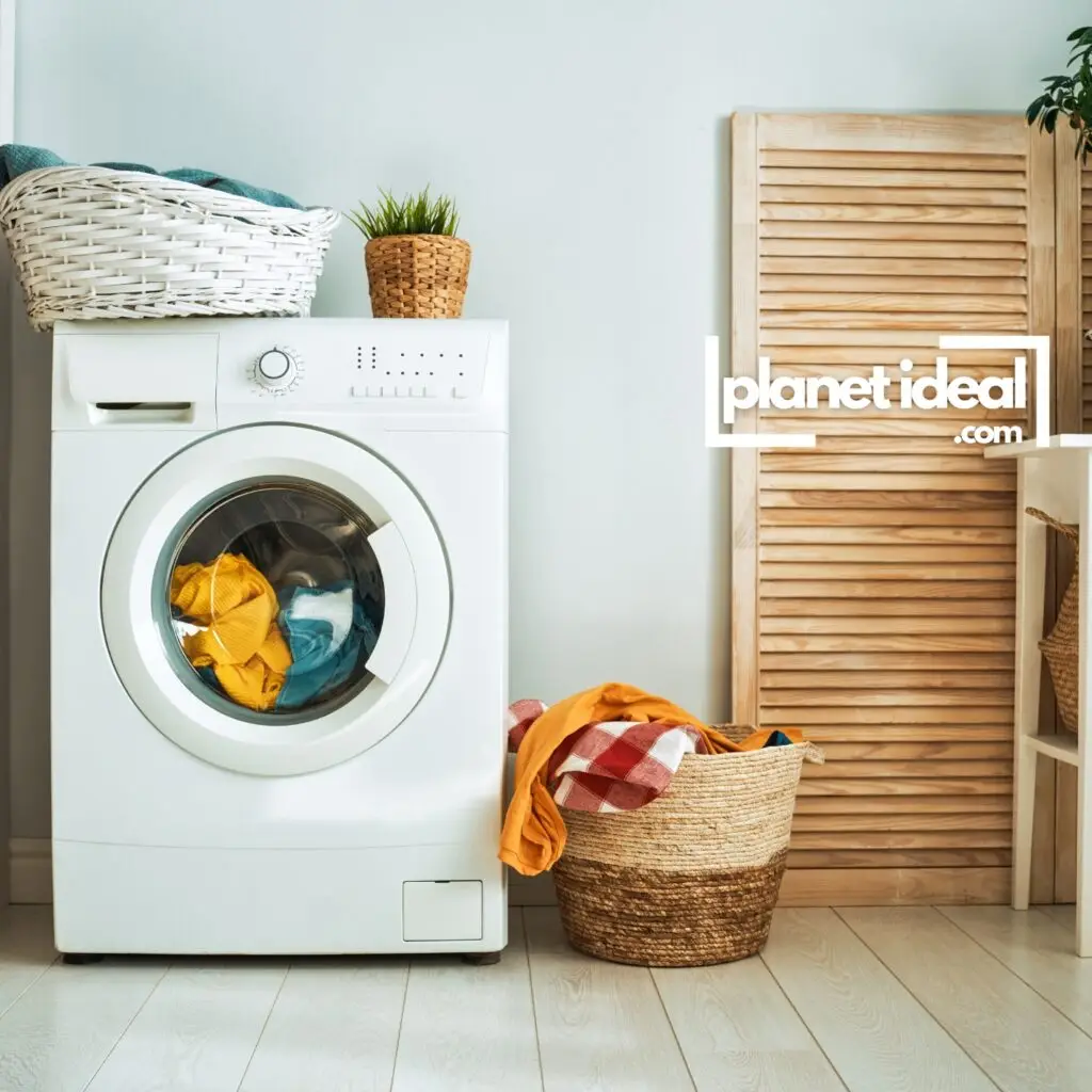 A laundry room with a high-efficiency washing machine and a basket of clothes.