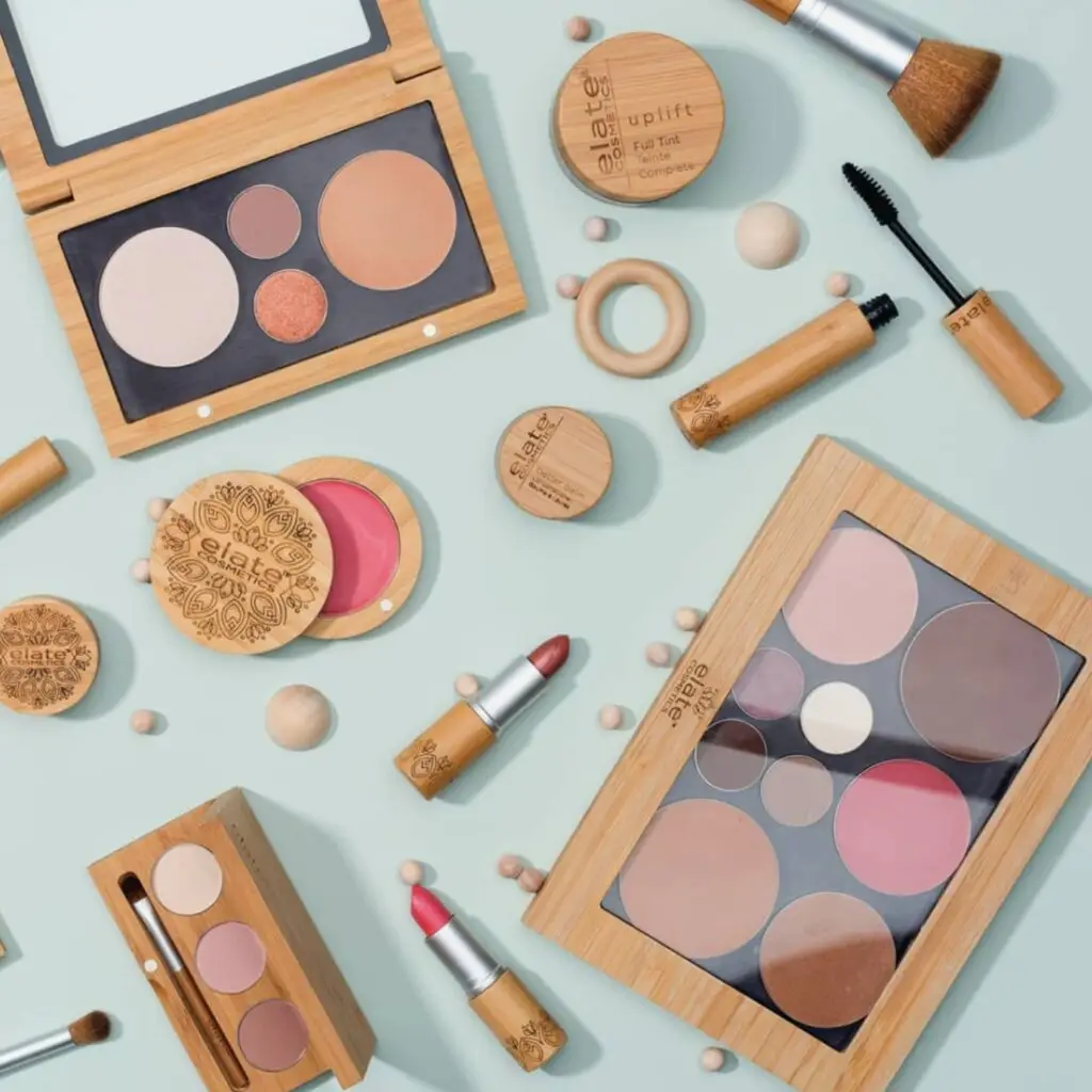 A minimalist flat lay of Elate Cosmetics makeup products, including lipsticks and palettes