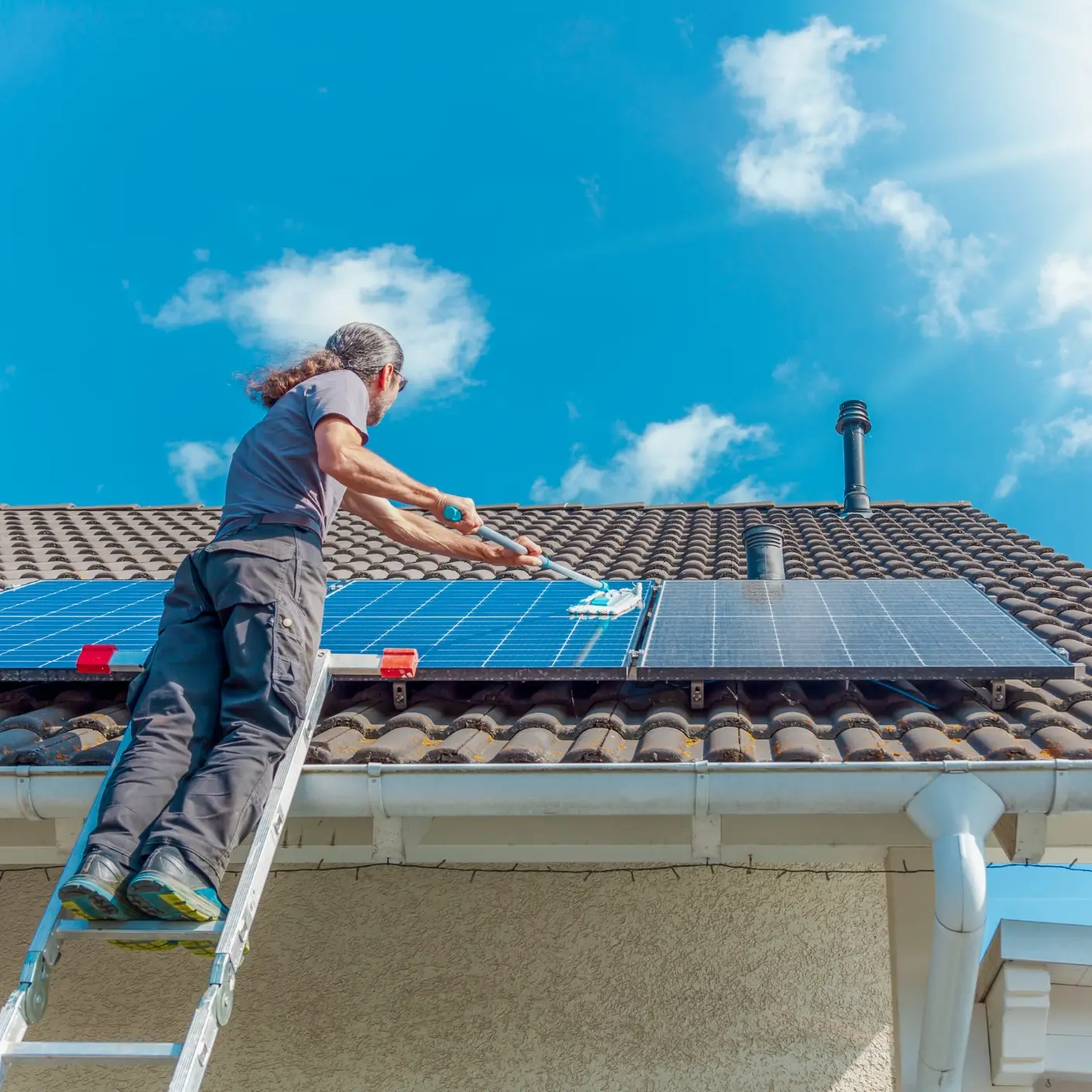 A person cleaning solar panels