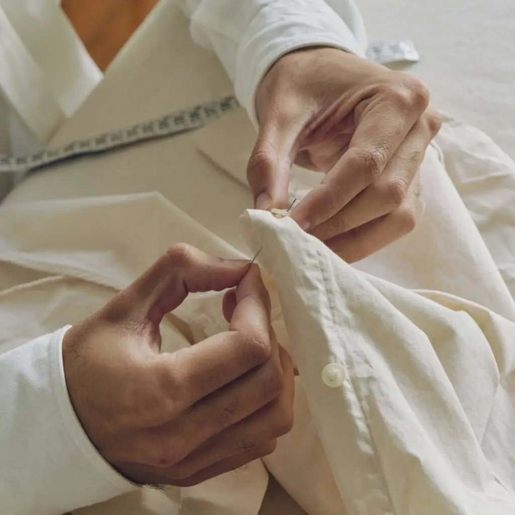 A person repairing clothes