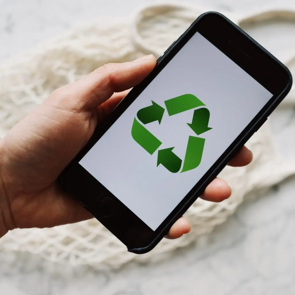 A Person using a Recycling App on their Phone