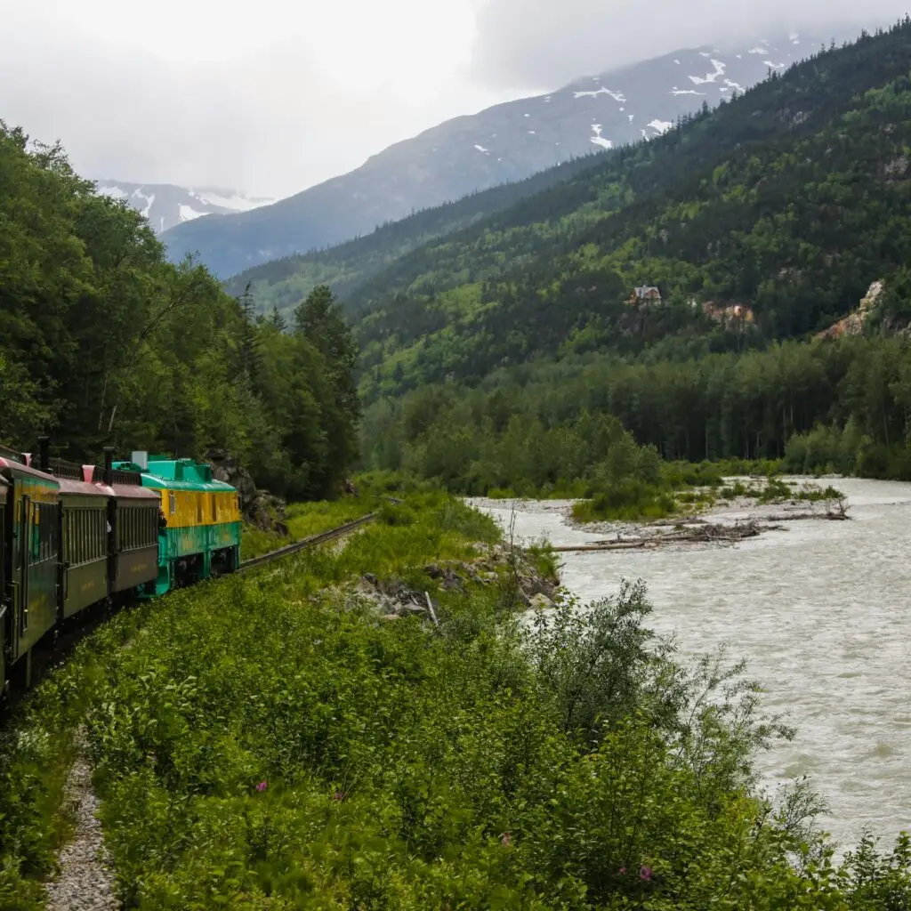 A scenic train winding through mountains