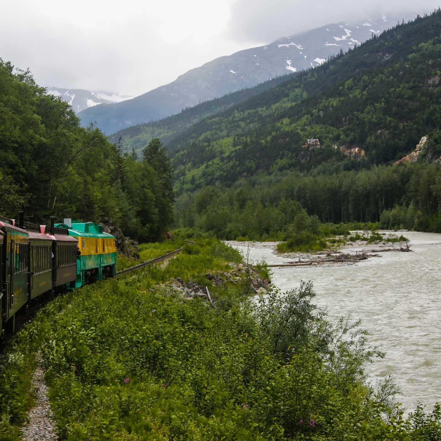A scenic train winding through mountains
