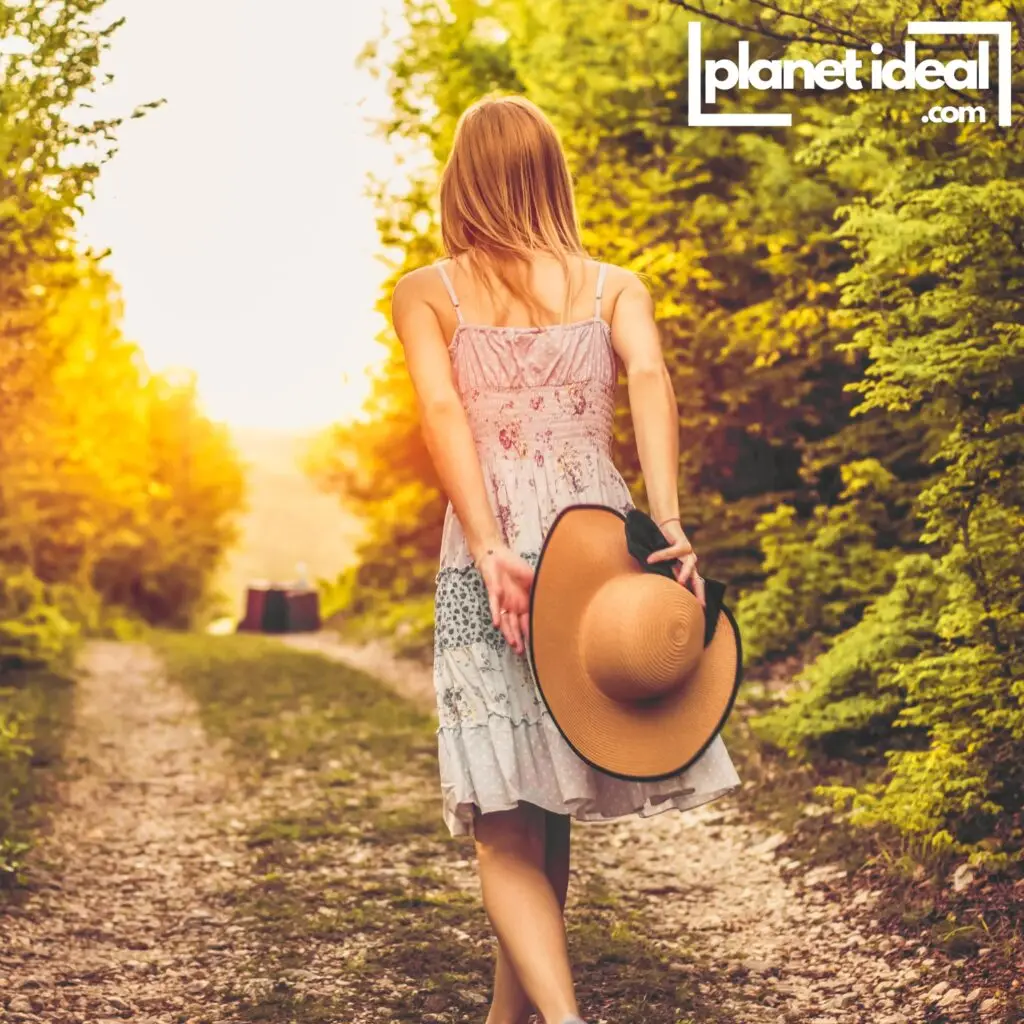 A serene image of someone walking through a lush forest trail, representing the calming benefits of connecting with nature.