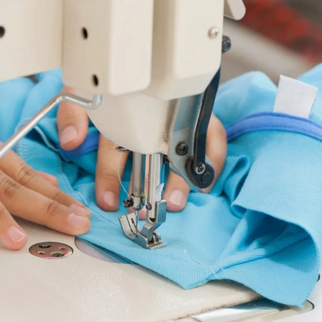 A sewing machine with fabric and pins