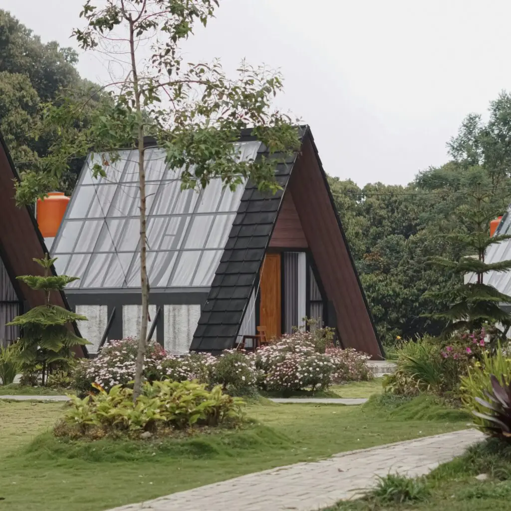 A serene eco-lodge nestled in lush greenery, representing sustainable travel accommodations.