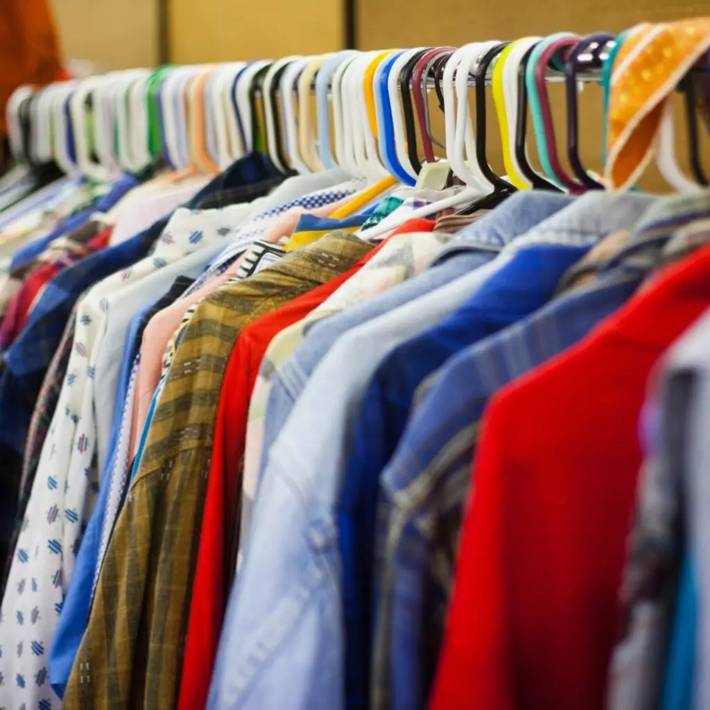 vibrant thrift store display with racks of colorful clothing