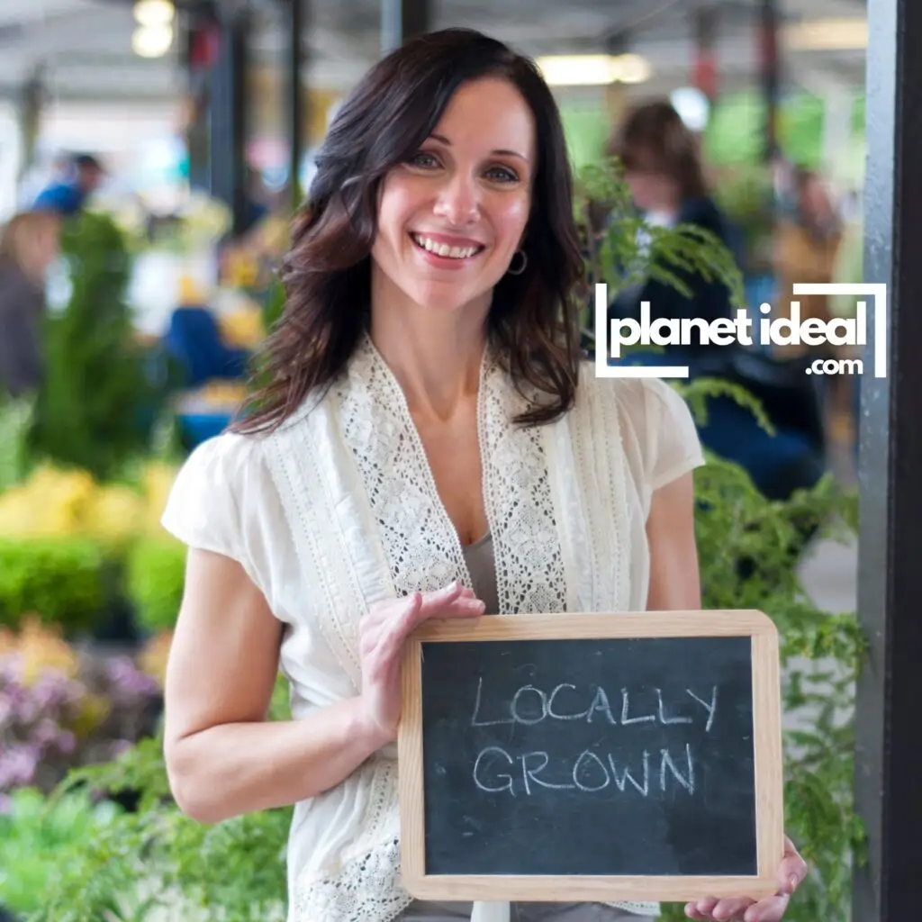 A close-up of a store label highlighting “Locally Grown” next to fresh produce.