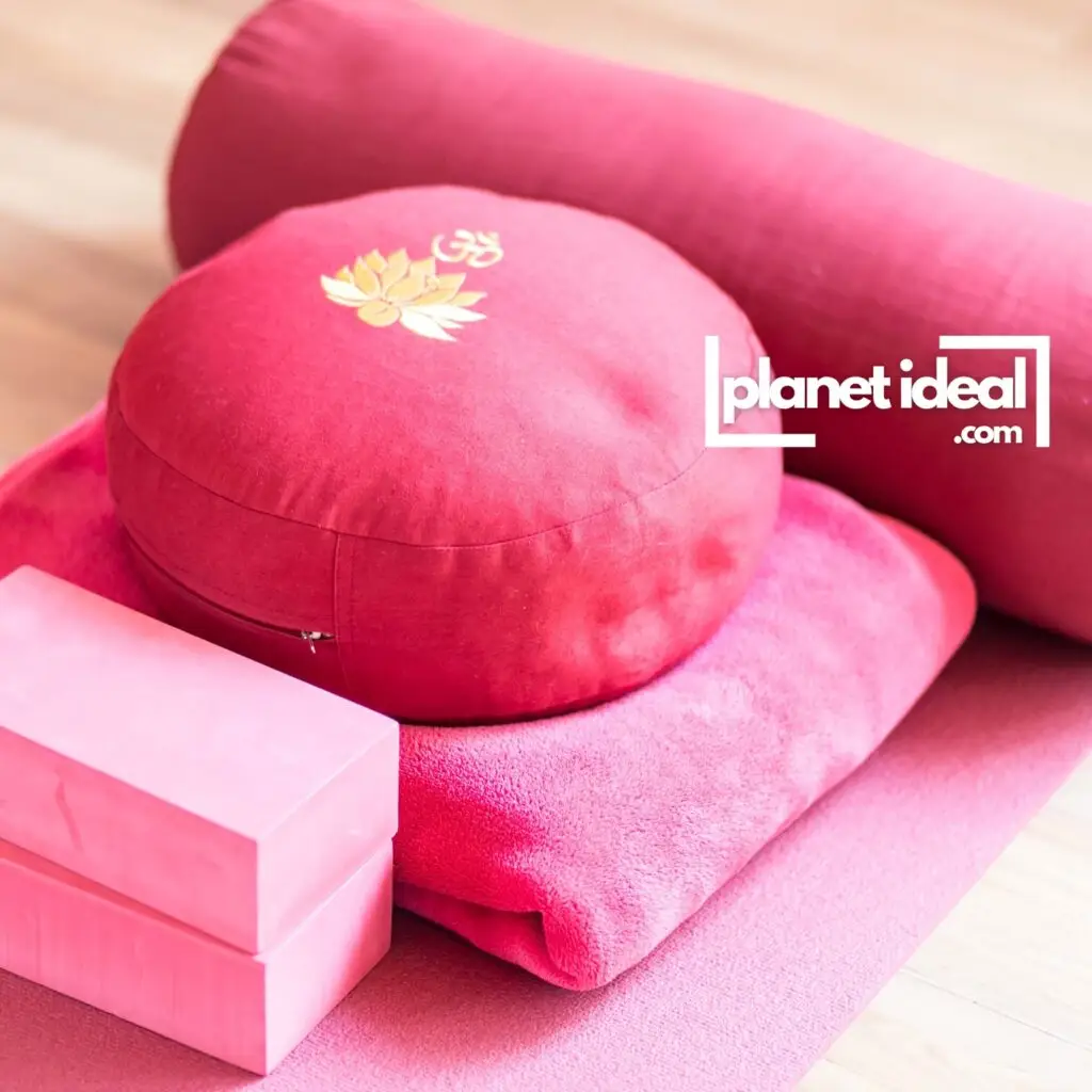 A serene yoga setup featuring an organic cotton mat, a meditation cushion, and natural sunlight.