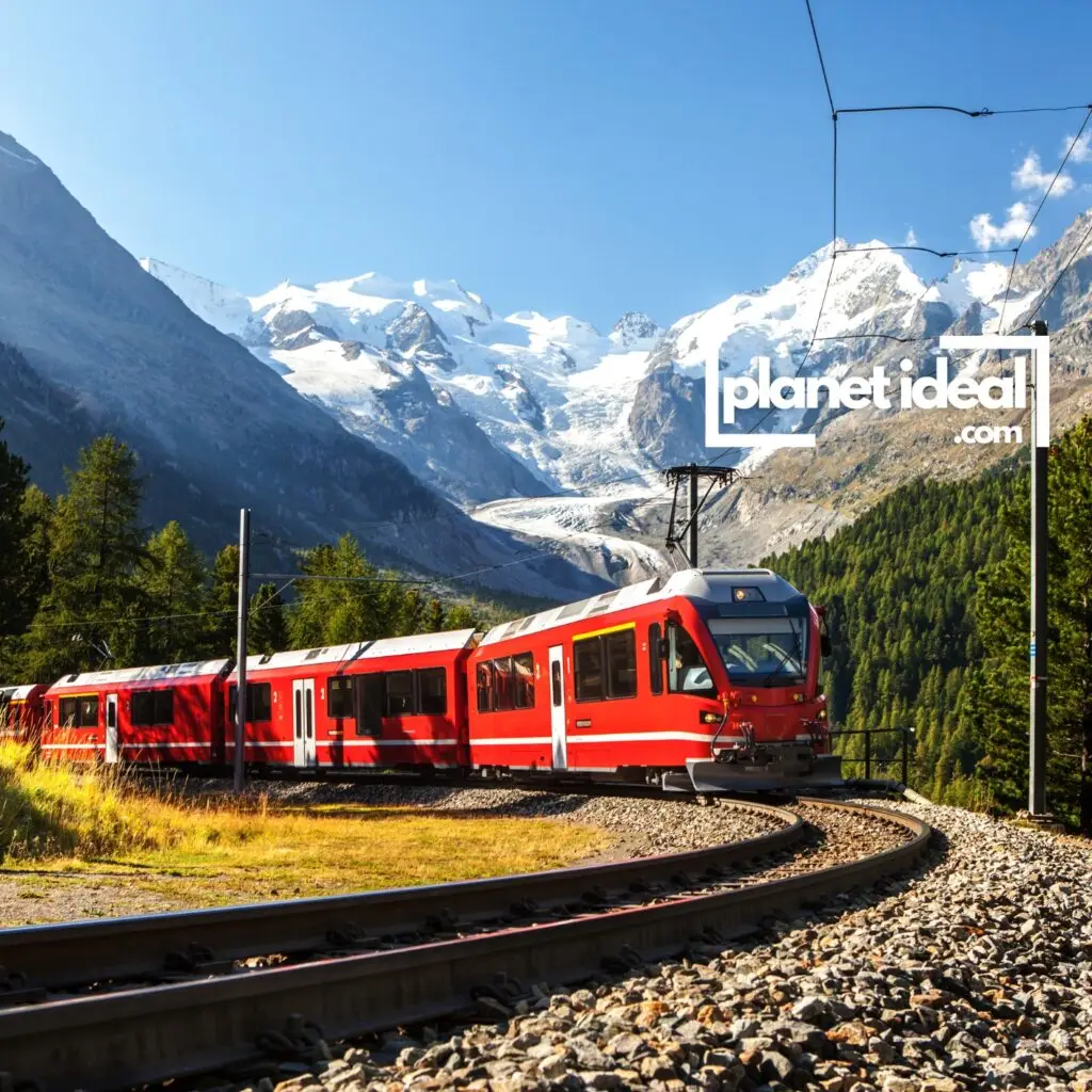 A stunning mountain view from a train window, showcasing snow-capped peaks