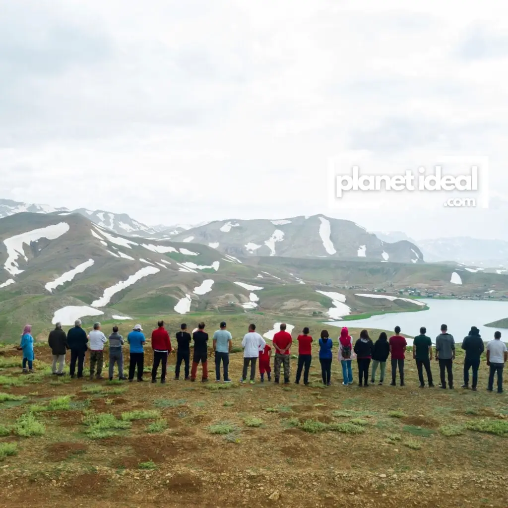 An image of a tour group exploring a pristine natural landscape, with minimal visible impact on the environment.