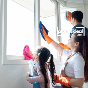 A Happy family cleaning together, using eco-friendly tools
